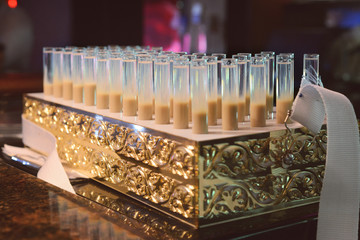 alcohol cocktails in test tubes in concept bar at the party