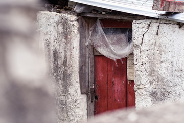 Grunge worn dirty house entrance of very pool people