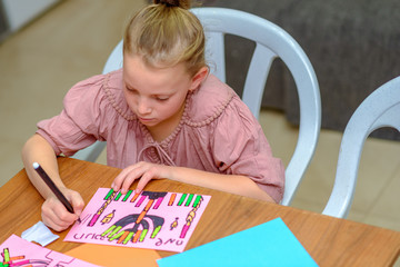 Needlework, crafts children.Little girl create a greeting card image of the Jewish holiday of...