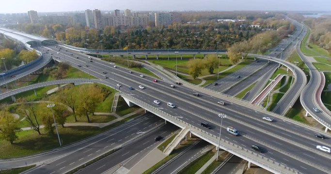 Time Lapse. Flying Over Highway Intersection. Cars Go On A High Speed