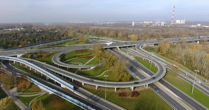 Cars Go Through The Highway Intersection. Aerial, Panorama, Time Lapse