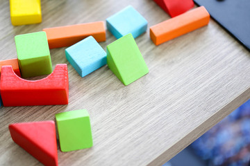 Parent and little child having fun playing educational toys,Family concept.