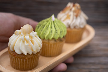 Tasty mini cupcakes on a vintage background, sweet dessert for christmas, new year and valentine holliday