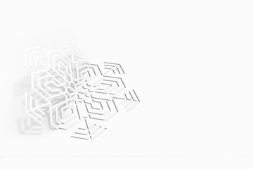 Carved paper snowflake folded in half, bent, casts a beautiful shadow o 3d illustration
