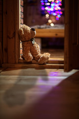 plush teddy bear sitting alone on Christmas Eve time