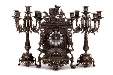 Vintage watch with two candelabra on white background