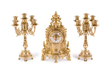 Vintage watch with two candelabra on white background