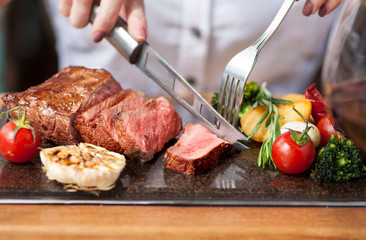 Woman eating steak