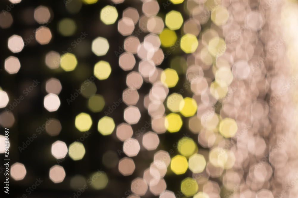 Wall mural blurred light gold bokeh abstract background for use christmas background.