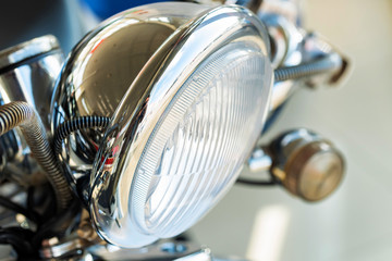 Close up headlight of a modern motorbike