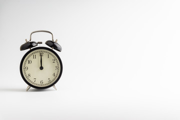 Alarm clock isolated on white background with selective focu