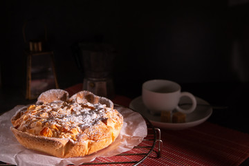 homemade almond frangipane cake in selective lighting