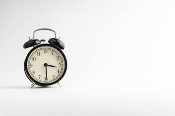 Alarm clock isolated on white background with selective focu
