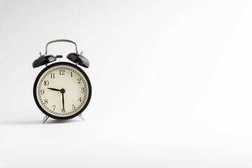 Alarm clock isolated on white background with selective focu
