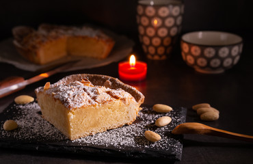 homemade almond frangipane cake in selective lighting