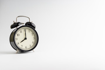 Alarm clock isolated on white background with selective focu