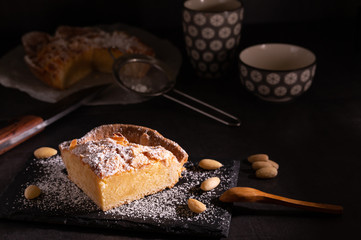 homemade almond frangipane cake in selective lighting