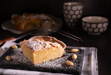 homemade almond frangipane cake in selective lighting