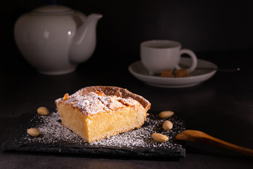 homemade almond frangipane cake in selective lighting
