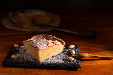 homemade almond frangipane cake in selective lighting