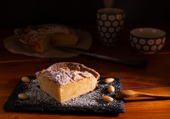 homemade almond frangipane cake in selective lighting