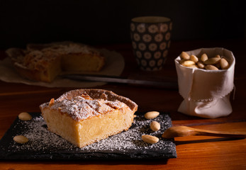 homemade almond frangipane cake in selective lighting