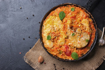 fish with tomato sauce and aroma spices, stock photo