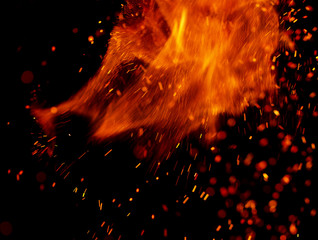 flame of fire with sparks on a black background