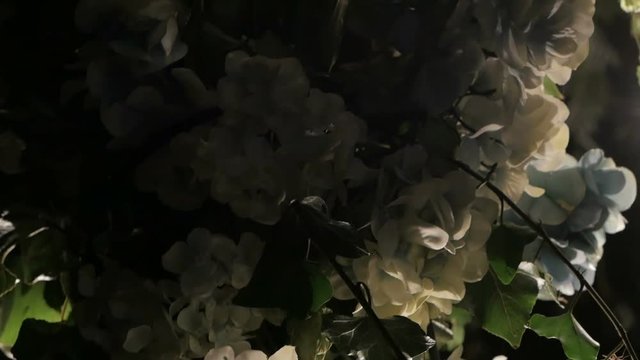 Butiful floral night wedding decorations with soft light of lamps.