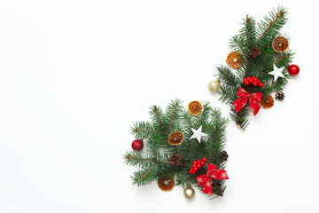 Christmas composition with Christmas tree branches and Christmas decorations on white background