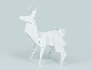 Paper deer isolated on blue, clipping path included
