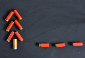 New Year concept. Congratulations for the hunter with hunting cartridges on the colored background...
