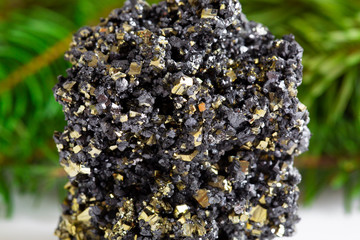 Macro shooting of natural gemstone. The raw mineral is pyrite, China. Isolated object on a white...