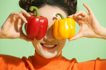Young women with chili peppers