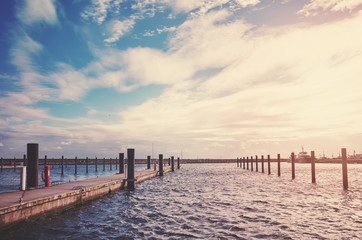 Vintage stylized picture of an empty marina in Sassnitz at sunset, Germany.