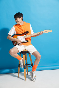 Young men play the guitar
