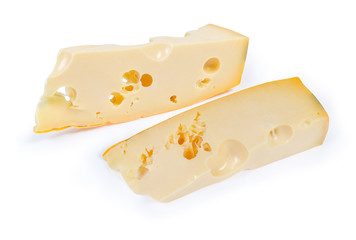Pieces of maasdam cheese on a white background