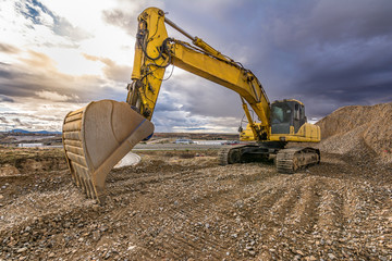 Large excavator on construction works of a highway
