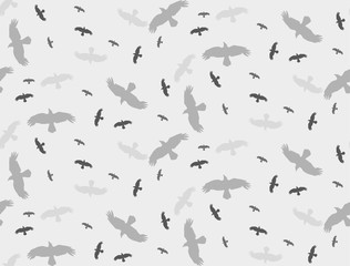 seamless background with a silhouette of flying birds gray