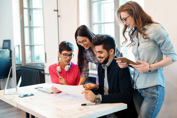 Picture of young architects discussing in office