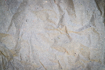 Crumpled grey wrapping  paper texture. Natural recycled paper for packaging