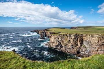 The cliffs of Yesnaby with the 35m high surf pillar, called Yesnaby Castle Sandwick, Mainland, Orkney Islands, Scotland, Great Britain
