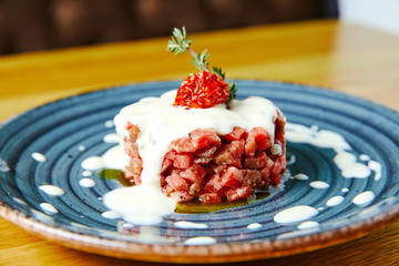 Tartar of beef with a fondue of Parmesan cheese