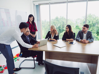 business people in meeting room,Business team explaining new business ideas