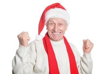 Portrait of a senior man in Santa hat