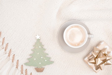 Christmas composition. Xmas decorations, coffee, gift on textile beige background. Christmas, New Year, winter concept. Flat lay, top view, copy space