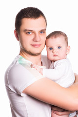 Happy father holding a cute baby child, isolated on white background