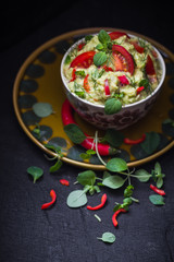 bowl guacamole tomato chilli pepper lime onion garlic dill and oregano