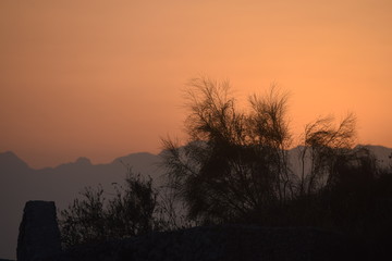 Sunset concealed by mountains