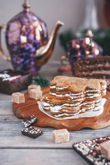 Chocolate brown cupcake with walnuts, cinnamon and honey on the Christmas table